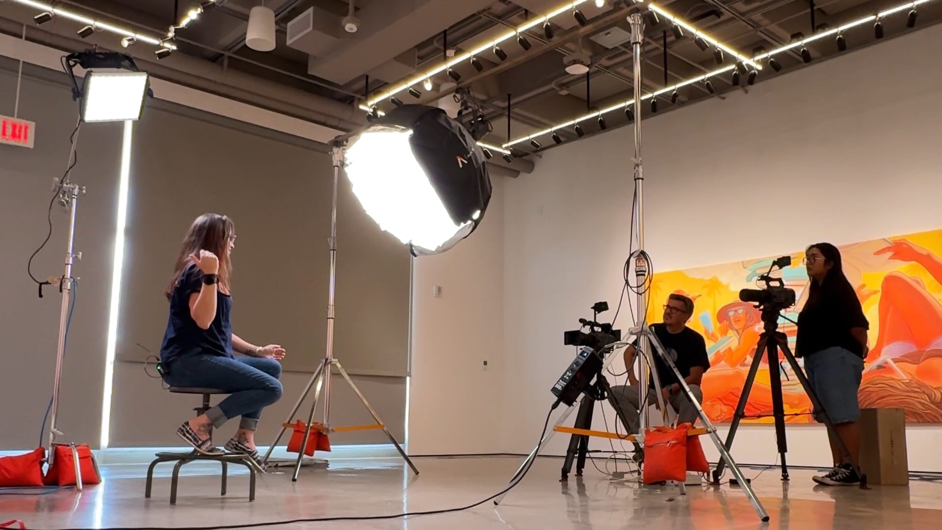 Behind the scenes footage filming an artist interview.